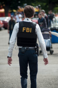Illzach - France -9 June 2019 - Portrait of man with FBI uniform and bullet proof at fun car show event