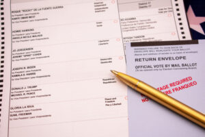 Official election vote by mail ballot with a gold pen focused on the presidential candidates with a shallow depth - San Jose, California, USA - October 8, 2020 Official election vote by mail ballot with a gold pen focused on the presidential candidates with a shallow depth - San Jose, California, USA - October 8, 2020
