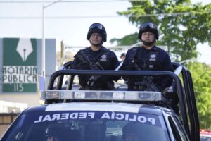 LOS MOCHIS, MEXICO - Nov 20, 2019: 2 police officers during civic military parade on independence day in 20th of november LOS MOCHIS, MEXICO - Nov 20, 2019: 2 police officers during civic military parade on independence day in 20th of november